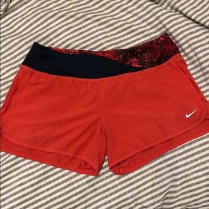 Pink Nike running shorts